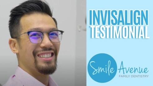 Smiling person with glasses giving a testimonial for Invisalign at Smile Avenue Family Dentistry in Katy, TX.