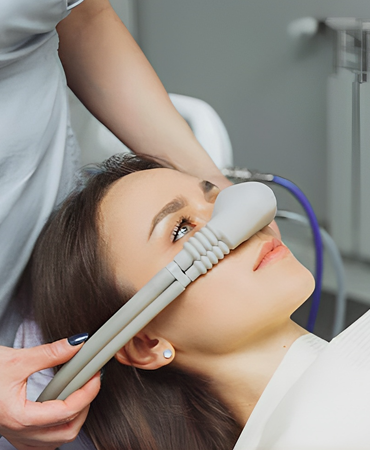 Patient receiving dental sedation with advanced technology at a dental clinic in Katy, enhancing comfort for a beautiful smile.