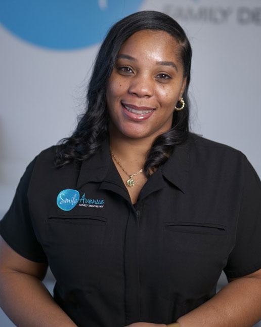 Smiling dental professional at Smile Avenue Family Dentistry in Cypress & Katy, TX, showcasing friendly and welcoming patient care.