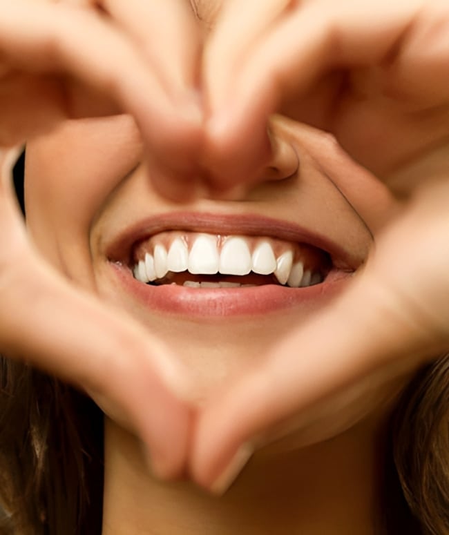 Use it or Lose it1 1 Woman Making A Heart Shape With Her Hands Framing Her Bright Smile