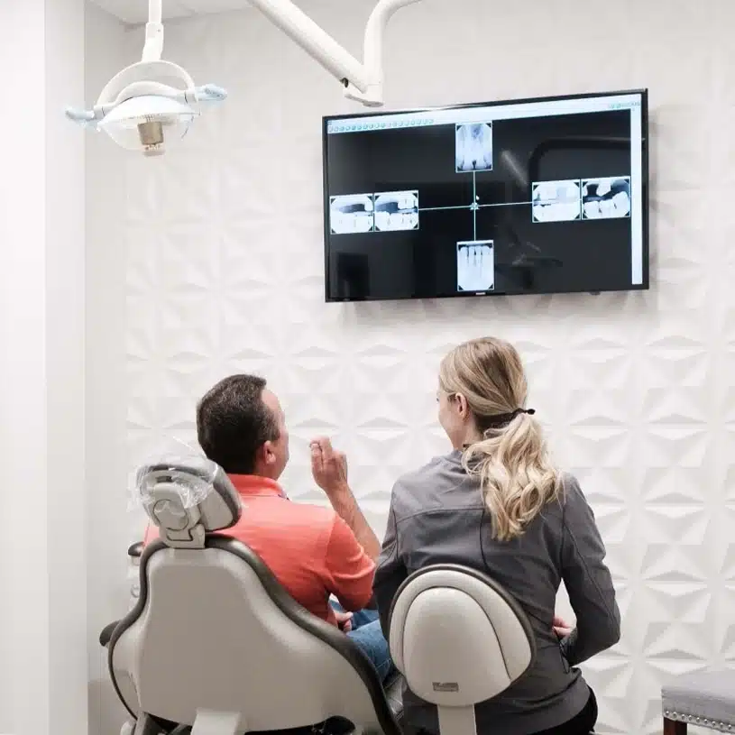 Emergency Dentist LP1 22 Dentist consulting with a patient seated in a dental chair