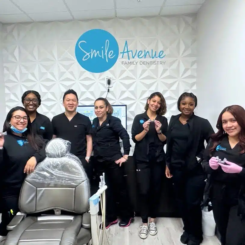 Emergency Dentist LP1 21 Smile Avenue Family Dentistry team group photo in the office