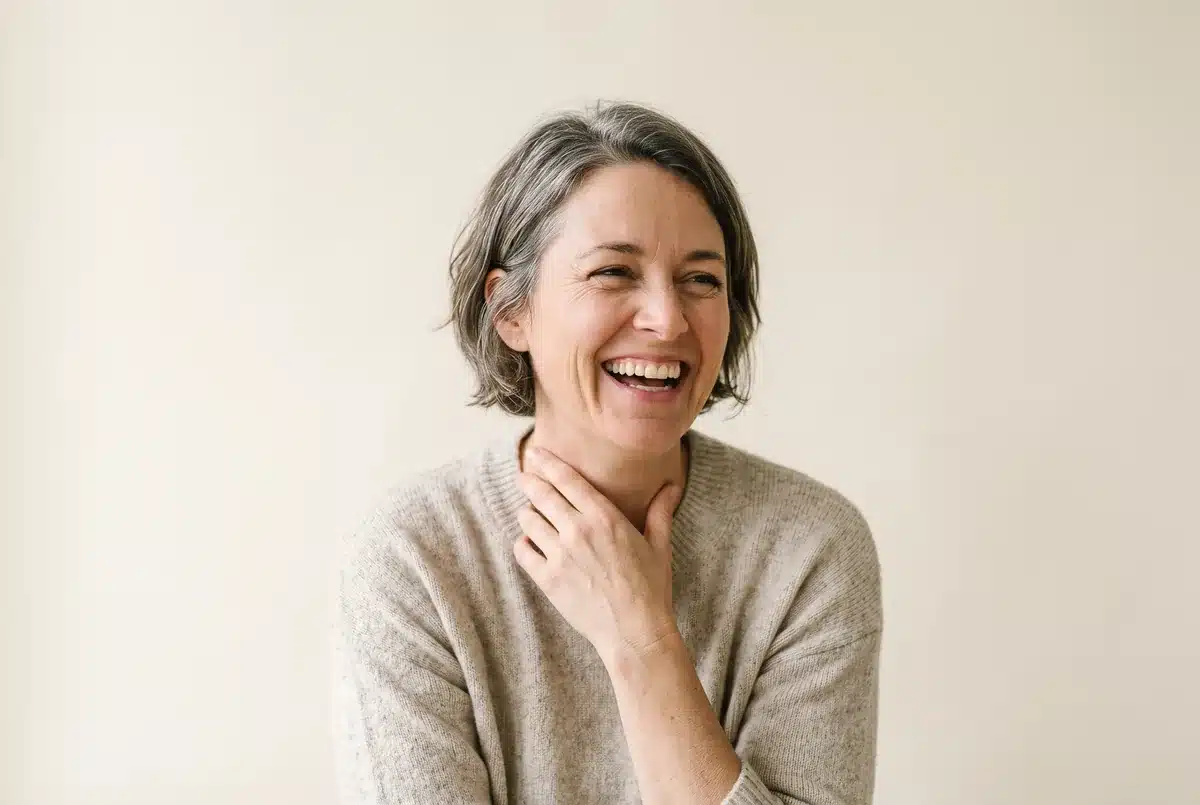 A woman in her forties laughing